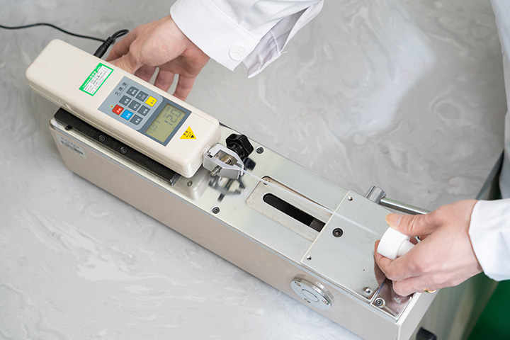 measuring machine checking a spray topper